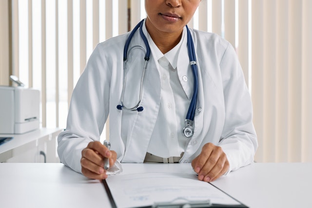 woman doctor prescribing online to a digital pharmacy and telemedicine consult