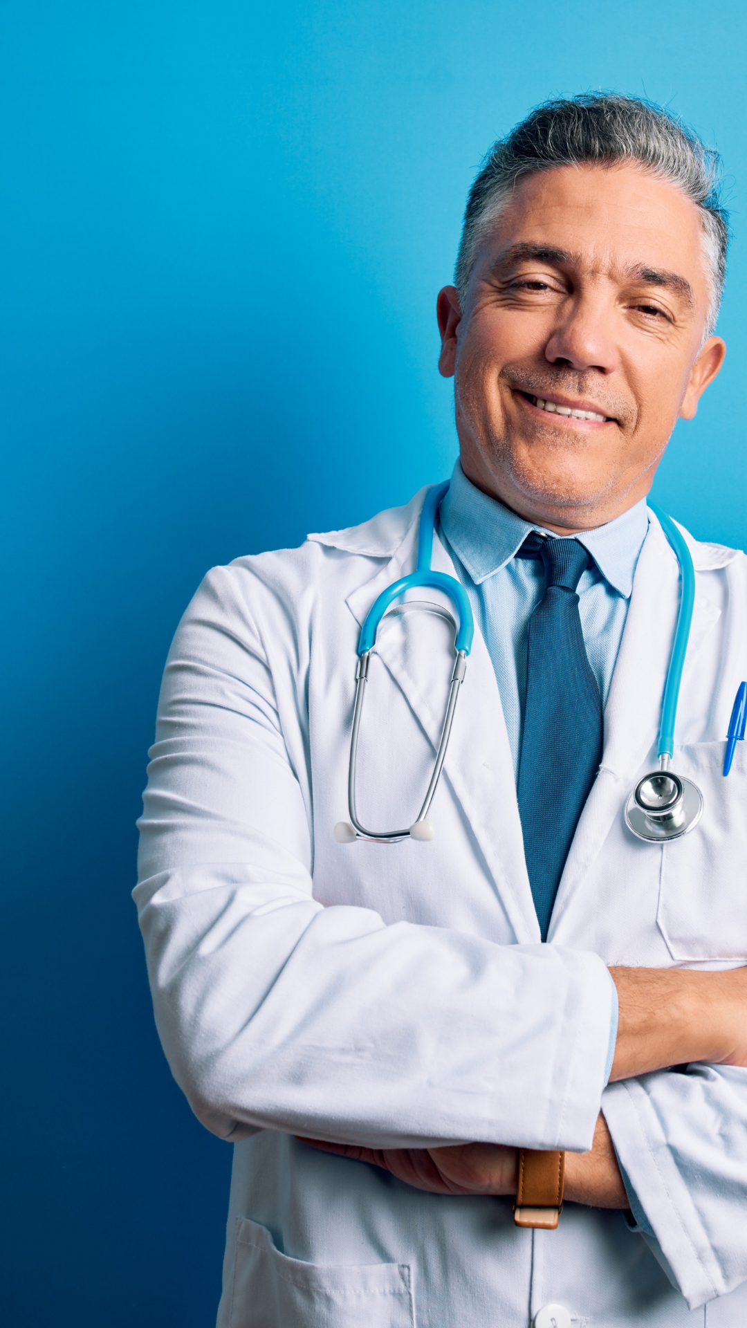 Physician in white labcoat next to blue background