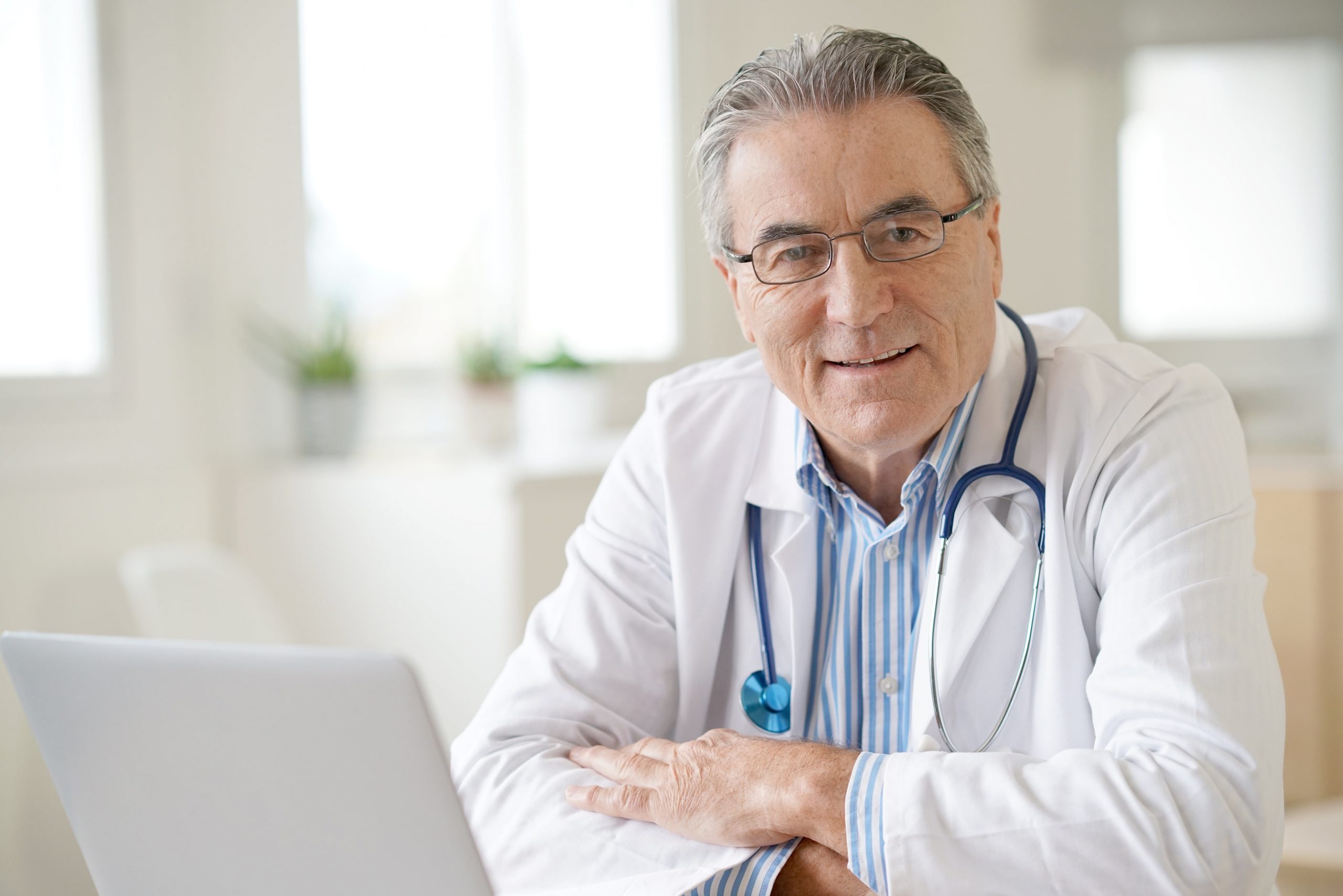middle aged retiring doctor joins telemedicine platform to provide online health coaching