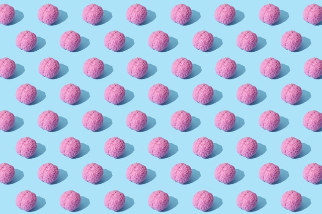 multiple pink brains on a light blue background