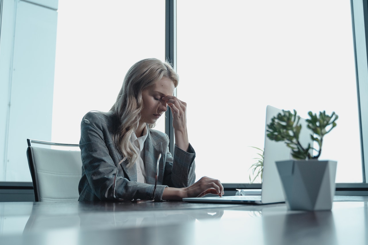 female HR professional stressed out due to staff shortages and mass resignations