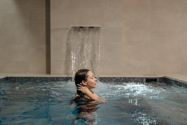 young woman with MS using hydrotherapy for muscle aches and stiffness